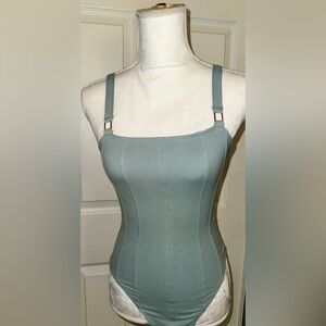 Baby blue waist snatching body suit with gold buckles, similar to Chanel/Versace